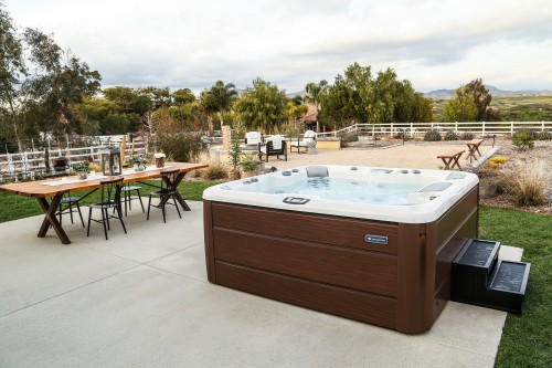 Outdoor hot tub installation on a concrete patio
